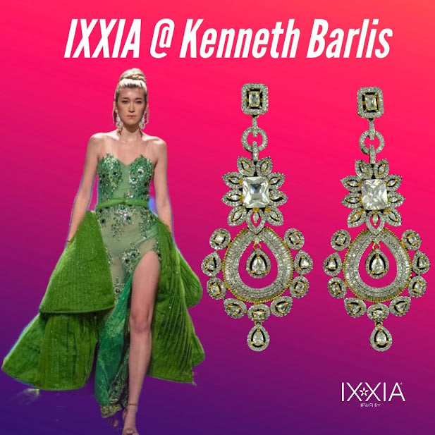 Green evening gown with matching earrings on a purple background