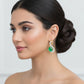 A pair of swan-shaped dangle earrings with green and gold color accents